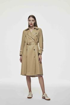 This oversized silhouette trench coat adds extra details to this essential style. The classic trend is updated and elevated with cuff straps, an elongated deep-back yoke, and a flattering waist belt. Match with dresses or jeans to create a chic look. - Midi length - Flattering waist belt 100% cotton Lining: 55%Polyester, 45%Viscose Our model is 177cm. Wearing size S. 22CT016 Classic Long Raincoat For Fall, Classic Fall Workwear Raincoat, Classic Fall Raincoat For Work, Chic Raincoat For Workwear, Long Business Raincoat For Fall, Classic Belted Raincoat For Work, Elegant Raincoat For Workwear In Fall, Business Long Raincoat For Fall, Fall Workwear Gabardine Raincoat