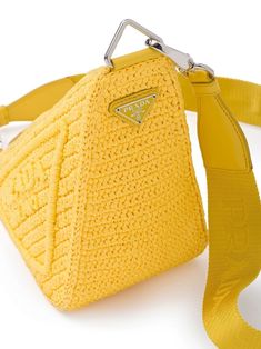 a yellow cross body bag on a white background