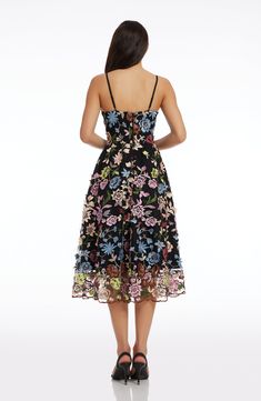 A lush garden scene is embroidered all over this figure-flattering dress in Black Multi. The Maren is topped with a slim, plunging bodice and finished with a breezy, flared skirt. Floral Applique Spaghetti Strap Party Dress, Spaghetti Strap Dress With Floral Applique For Party, Floral Applique Lace A-line Dress, Floral Embellished V-neck Gala Dress, Floral Embellished V-neck Dress For Gala, Floral Embroidered Evening Dress For Spring Gala, Floral Embellished Evening Dress For Summer, Spring Lace Midi Dress For Gala, Fitted A-line Floral Dress With Embroidery