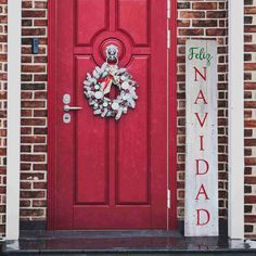 a red door with a teddy bear wreath on it and a sign that says friday