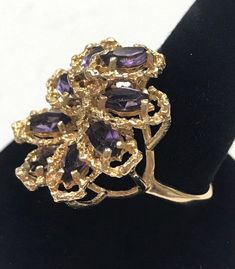 "Vintage 14K Yellow Gold 4 CTW Marquise Amethyst Filagree Cluster Ring Size 11.5 GORGEOUS Unique and rare design, Fine Marquise Amethyst Ring! This item is vintage and beautiful that is sure to be one of your favorite pieces! Approximately 4 CTW, ring has 8 - .50ct marquise cut amethysts. Ring face measures approximately 1\"!! Brilliant Purple Vivid Hue 10.4 Grams of solid 14K yellow gold Shipped insured/delivery confirmation I guarantee item to be exactly as described and pictured." Gold Cluster Jewelry With Gemstone Accents, Purple 14k Stamped Ring, Purple 14k Stamped Collectible Jewelry, Purple Cluster Jewelry For Formal Occasions, Estate Style Collectible Gemstone Jewelry, Black Opal Pendant, Puffed Heart, Black Gift Boxes, Tourmaline Ring