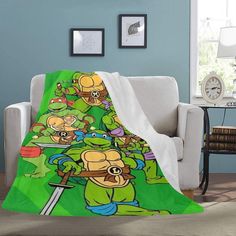 the teenage mutant ninjas blanket is shown on a chair in front of a blue wall