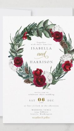 a wedding card with red roses and greenery