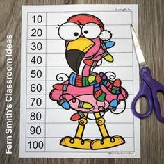 a cut out of a cartoon bird with numbers on it and scissors next to it