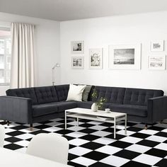 a black and white living room with checkered flooring