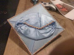 a table topped with a blue cloth covered object