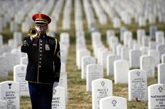 a soldier in uniform standing next to headstones with the words memorial day have we forgotten what it stands for?