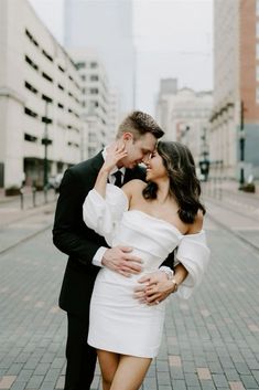 a man in a tuxedo and a woman in a white dress