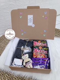 an open box filled with chocolates and candy