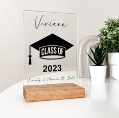 a clear acrylic plaque with a black graduation cap on it and the words, virginia class of 202