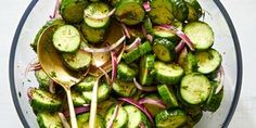 cucumbers and onions are mixed together in a bowl