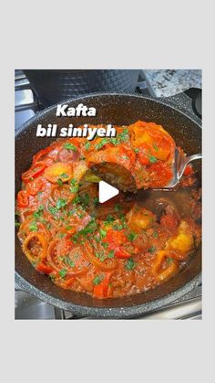 a skillet filled with food and the words kafta bill siniyen