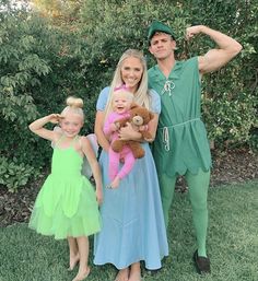 a man and two girls dressed up in costumes