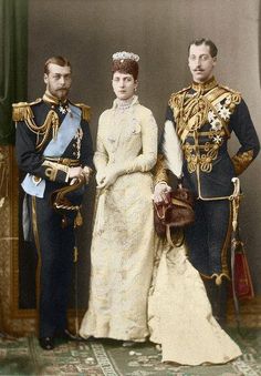 an old photograph of two men and a woman in formal dress