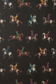 an image of horses and jockeys on black background