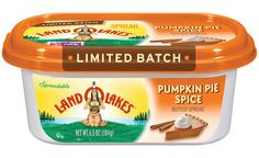 an ice cream container filled with pumpkin pie spice and whipped cream on the top is labeled land o'lakes limited batch