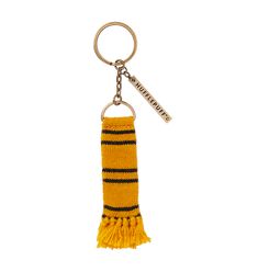 a key chain with a yellow and black striped scarf hanging from it's side