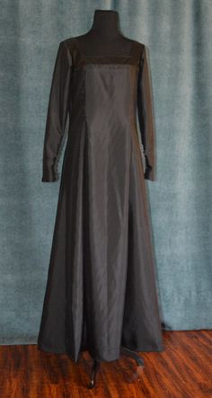 We offer READY TO SHIP Renaissance/ Medieval Dress (lined) with dagged hemlines on the side and undertunic (black). Picture number 5 shows detail of dagged hemline. Decoration on the front. Snap closures on dagged hemlines. Undertunic is unlined with zip closure on back and long sleeves. Size: Medium. Fabric: polyester blends. Visit my youtube channel for more details of this outfit (you will have to copy/paste the URL into your address bar): https://www.youtube.com/watch?v=ESPwoP8sE7Q The dress Traditional Fitted Medieval Dress With Long Sleeves, Fitted Long Sleeve Victorian Dress In Medieval Style, Fitted Traditional Long Sleeve Medieval Dress, Fitted Medieval Dress With Long Sleeves For Evening, Medieval Style Fitted Formal Dress, Medieval Long Sleeve Formal Dresses, Fitted Long Sleeve Victorian Dress, Fitted Long Sleeve Victorian Dress For Medieval Festivals, Luxury Fitted Historical Medieval Dress