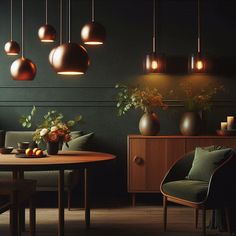 a dining room with green walls and hanging lights above the table, along with two chairs