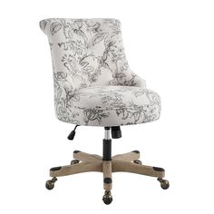 an office chair with wheels and a floral print upholstered on the backrest