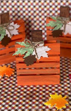 small wooden boxes with fall leaves on them