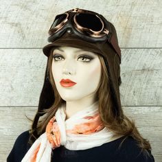 Aviator hat made of genuine leather, chestnut brown, for women. Unisex hat Embrace the spirit of adventure in style with our chestnut aviator cap. Add up some fabulous aviator goggles and you're sure to turn heads while being protected from the elements. This aviator hat is made from high quality and durable materials including genuine soft leather with a beautiful grain finish. Antique brass snaps and buckles on the straps provide a comfortable fit under the chin and on the back with a retro to Vintage Hats With Adjustable Ear Flaps, Brown Aviator Winter Hats, Winter Brown Aviator Hats, Vintage Brown Travel Hat, Brown Winter Hats, Steampunk Brown Adjustable Hat, Brown Retro Hat For Outdoor, Steampunk Brown Brimmed Hats, Steampunk Style Brown Brimmed Hat