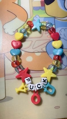 a close up of a bracelet with charms on it