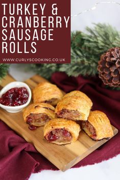 turkey and cranberry sausage rolls on a cutting board