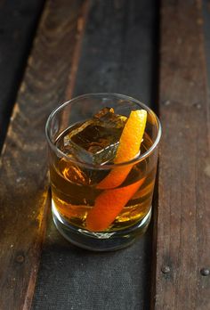 an orange peel in a glass with ice