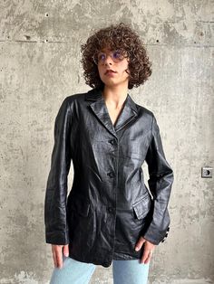 Vintage genuine leather women's blazer in black, fits XS-M, slim fit, lining made of polyester, gender neutral, soft leather, made in Spain, overall good vintage condition  measurements  sleeve 40 cm / 16" shoulders 60 cm / 24" length 72 cm / 28" bust from armpit to armpit 49 cm / 19" Casual Fitted Leather Jacket For Office, Fitted Leather Jacket With Notch Lapel For Winter, Casual Fitted Leather Blazer, Black Fitted Leather Jacket With Notch Lapel, Fitted Leather Blazer With Long Sleeves, Vintage Leather Fitted Blazer, Fitted Long Sleeve Single Breasted Leather Jacket, Black Leather Jacket For Spring Formal, Black Leather Jacket With Notch Lapel For Fall