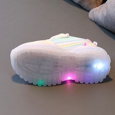 Your child will walk with grace in our Fairy Glowing Tennis Shoes which feature a cute fairy on the side and a glowing sole. These magical shoes will have them wanting to go on walks and get ready for their next adventure. The shoes also have a velcro strap and a chrome strip along the tip of the shoe that shines under light. Shop for our Fairy Glowing Tennis Shoes that come in pink and purple and enjoy! PRODUCT HIGHLIGHTS: Insole material : COTTON Sole material : RUBBER gender : Unisex Compatib White Light-up Sneakers With Round Toe, Disney Sneakers, Disney Slippers, Led Shoes, Rain Shoes, Cute Fairy, Kids Sneakers, Velcro Straps, Snow Boots