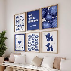 a living room filled with furniture and pictures on the wall above it's couch