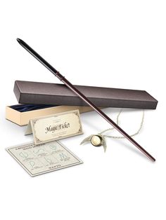 harry potter's wand and money are on display in a box with its lid open