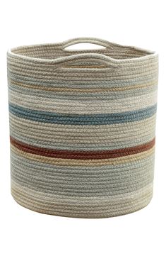 a large round basket with multicolored stripes on the bottom and sides, sitting on a white background