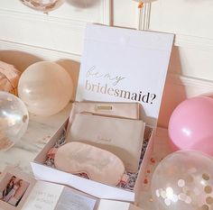 the bridesmaid box is open and ready to be filled with balloons, confetti, and cards