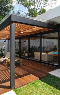 a modern house with an outdoor swimming pool