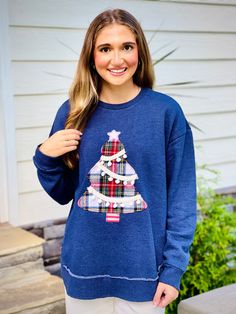 This Christmas Tree Pom Pom Sweatshirt is the perfect addition to your festive wardrobe. The soft fabric will keep you warm and cozy during the holiday season. The festive pom poms on the Christmas tree design add a playful touch to this sweatshirt. Spread holiday cheer with this fun and stylish sweatshirt. Fabric::: 60% cotton 40% polyester Brand::: Royce Christmas Tree Pom Pom, Sweatshirt Refashion, Boutique Trends, Sweatshirt Fabric, Christmas Tree Design, Tree Design, Maxi Dresses Casual, Tunic Sweater, Tree Designs