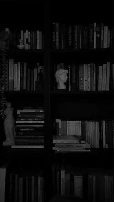 a bookshelf filled with lots of books next to a window