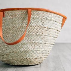 This oversized tote bag will take you everywhere you need to go! Woven with reeds and finished with attractive and durable leather accents and straps, the Rosemerra Handwoven Basket Tote has enough room for all of your essentials for a day at the beach, pool, park, and beyond. Exact size and shape will vary. Handcrafted by artisans with OTICART in Kenya. Chain Scarf, Candle Wall Decor, Sustainable Kitchen, Basket Tote, Oversized Tote Bag, Hand Woven Baskets, Oversized Tote, Leather Accents, Accessories Bags Purses