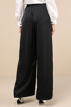 The Lulus Stunning Chicness Black Satin High-Rise Wide-Leg Pants will easily elevate any of your favorite fall 'fits! Sleek woven satin shapes these must-have pants that feature a high, banded waist (with elastic at the back for fit) and trendy, wide pant legs with pleated details, side seam pockets, and full-length hems. Hidden side zipper/clasp. Add a sweater and some boots and you'll instantly have a perfect ensemble! Fit: This garment fits true to size. Length: Floor length. Size medium Inse Sleek Silk High-waisted Wide Leg Pants, Sleek Satin Pants For Work, Elegant Satin Bottoms For Spring, Sleek Silk Pants For Workwear, Sleek Satin Pants For Evening, Chic Satin Finish Bottoms For Party, Satin Wide Leg Pants For Workwear, Chic Bottoms With Satin Finish For Party, Chic Party Bottoms With Satin Finish