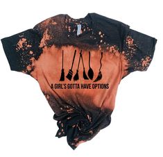 a black and orange shirt with three spoons on it