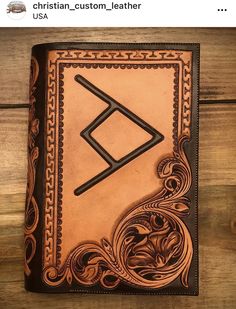 a leather journal with an intricate design on it