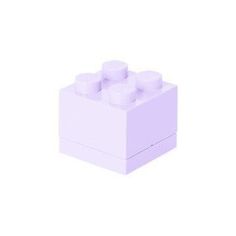 a purple lego block with three white candles