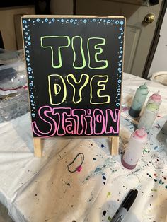 there is a sign that says the dye station on top of some crafting supplies