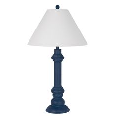 a blue lamp with a white shade on it