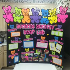 a bulletin board with teddy bears on it in a kitchen area for children to use