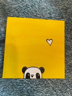 a painting of a panda bear with a heart on it's head and yellow background