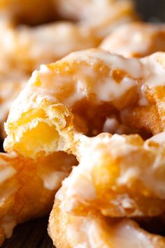 glazed donuts sitting on top of a wooden table