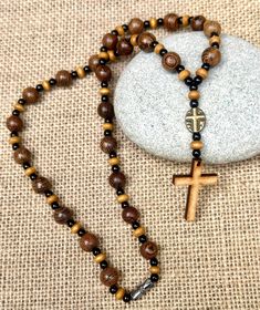 Handmade beaded necklace, Rosary necklace, Handmade jewellery, Cross necklace    -sandalwood beads-8mm    -acrylic beads-4mm    -antique bronze cross charm-12x8mm    -wooden cross-30x20mm All our items are made by us,we don't sell anything that we haven't made. Custom orders are welcome, please contact us if you have any question. ➡️All Orders Ship SAME or NEXT Day❗️ * All UK items are sent standard royal mail unless tracking is choose at check out * All abroad items are sent standard delivery u Adjustable Cross Necklace With Wooden Beads, Spiritual Brown Cross Necklace, Brown Crucifix Necklace In Spiritual Style, Handmade Spiritual Crucifix Necklaces, Brown Cross Necklace With Wooden Beads, Brown Wooden Beads Cross Necklace, Handmade Spiritual Crucifix Necklace, Brown Rosary With 8mm Beads And Cross Shape, Brown Wooden Beaded Cross Rosary