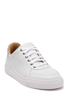 White shoes always add a fresh and clean look to an outfit. This leather sneaker is sporty yet classy with contrasting suede details and sleek silhouette.Sizing: True to size. Round toe. Leather construction. Suede heel detail. Lace-up closure. Padded footbed. White sole. ImportedOrders cannot be shipped to Canada, Alaska, Hawaii, Puerto Rico or P.O. Boxes. Modern Lace-up Sneakers With Stitched Sole, White Sports Sneakers With Stitched Sole, White Platform Sneakers With Contrast Sole For Light Sports, White Sneakers With Stitched Sole And Round Toe, Casual White Sneakers With Stitched Sole, White Leather Platform Sneakers For Light Sports, Custom White High-top Sneakers With Stitched Sole, High-top Custom Sneakers With Stitched Sole For Sports, White Leather Platform Sneakers For Casual Sports